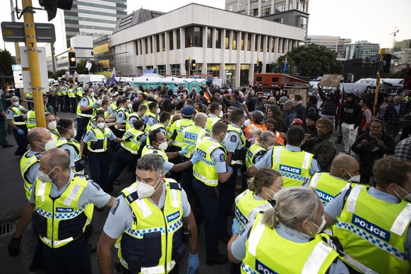 Police and protesters clash in Wellington, New Zealand, Tuesday, Feb. 22, 2022, as police tightened a cordon around a protest convoy that has been camped outside Parliament for two weeks. The proteste ...