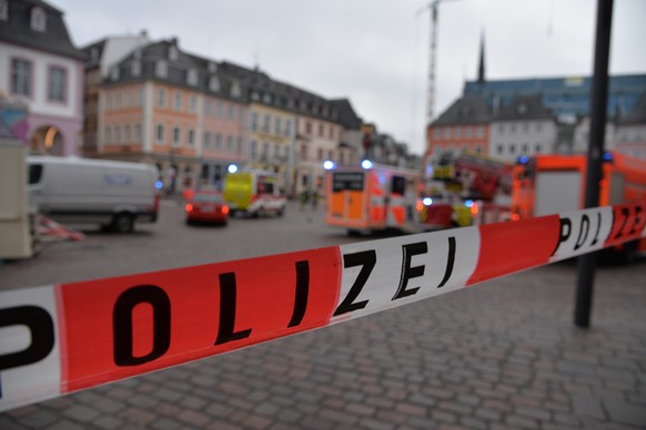 A square is blocked by the police in Trier, Germany, Tuesday, Dec. 1, 2020. German police say two people have been killed and several others injured in the southwestern German city of Trier when a car ...