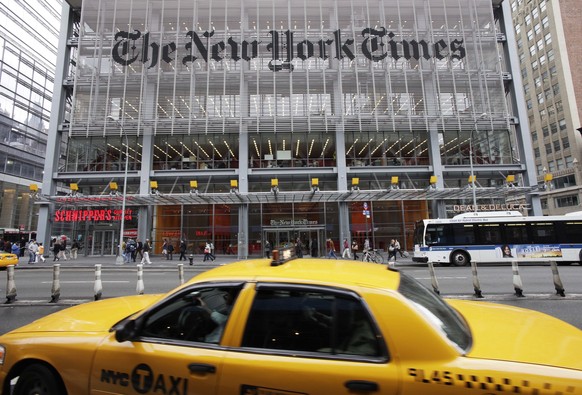 FILE - This Tuesday, Oct. 18, 2011 file photo shows the New York Times building in New York. The New York Times Co. reports earnings Thursday, Feb. 8, 2018. (AP Photo/Mark Lennihan, File)