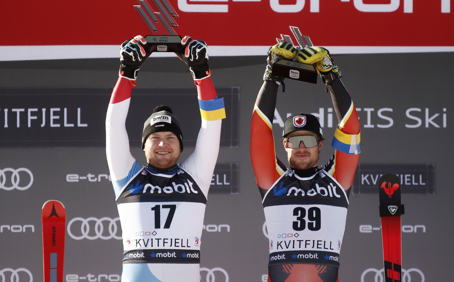 Canada&#039;s Cameron Alexander, right, and Switzerland&#039;s Niels Hintermann celebrate on the podium after winning with equal time an alpine ski, World Cup men&#039;s downhill in Kvitfjell, Norway, ...