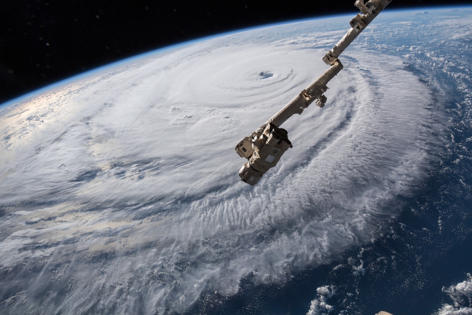 epa07016418 A handout photo made available by NASA on 13 September 2018 shows Hurricane Florence seen from a camera outside the International Space Station (ISS), in space, 12 September 2018, as the s ...