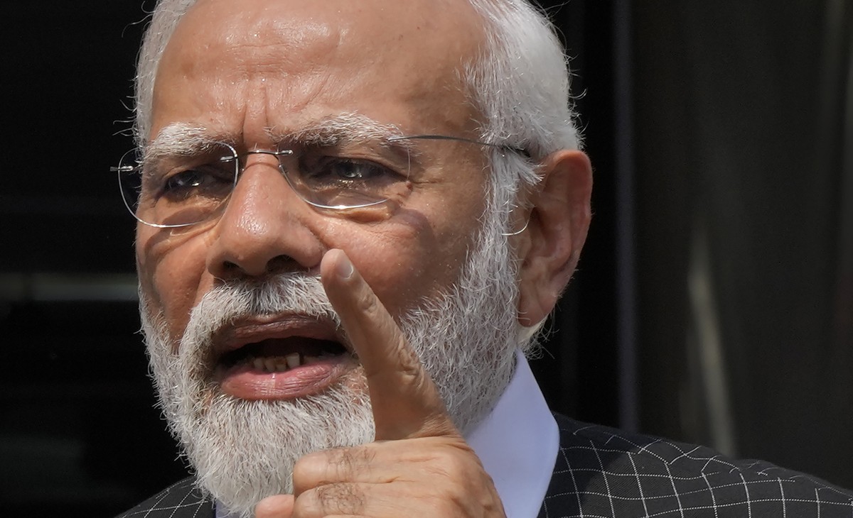 FILE - Indian Prime Minister Narendra Modi speaks as he arrives on the opening day of the monsoon session of the Indian parliament in New Delhi, India, Thursday, July 20, 2023. India?s fractured oppos ...