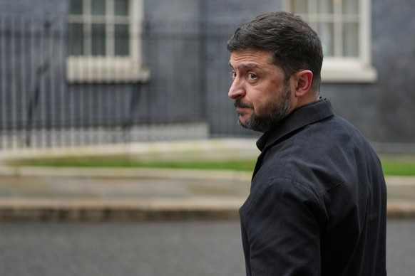 FILE - Ukrainian President Volodymyr Zelenskyy, looks back at the media in Downing Street, London, Monday, Dec. 8, 2025. (AP Photo/Kin Cheung, File)
Russia Ukraine War Elections Explainer