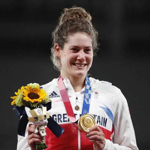 epa09400705 Gold medalist Kate French of Great Britain poses on the podium during the medal ceremony of the Modern Pentathlon event at the Tokyo 2020 Olympic Games at the Tokyo Stadium in Chofu, Tokyo ...