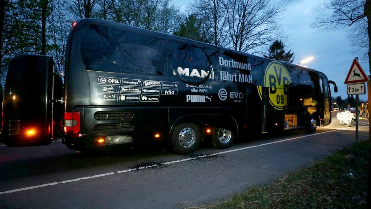 epa05903377 Team bus of Borussia Dortmund is seen on a street after it was hit by three explosions in Dortmund, Germany, 11 April 2017. According to reports, Borussia Dortmund's team bus was dama ...