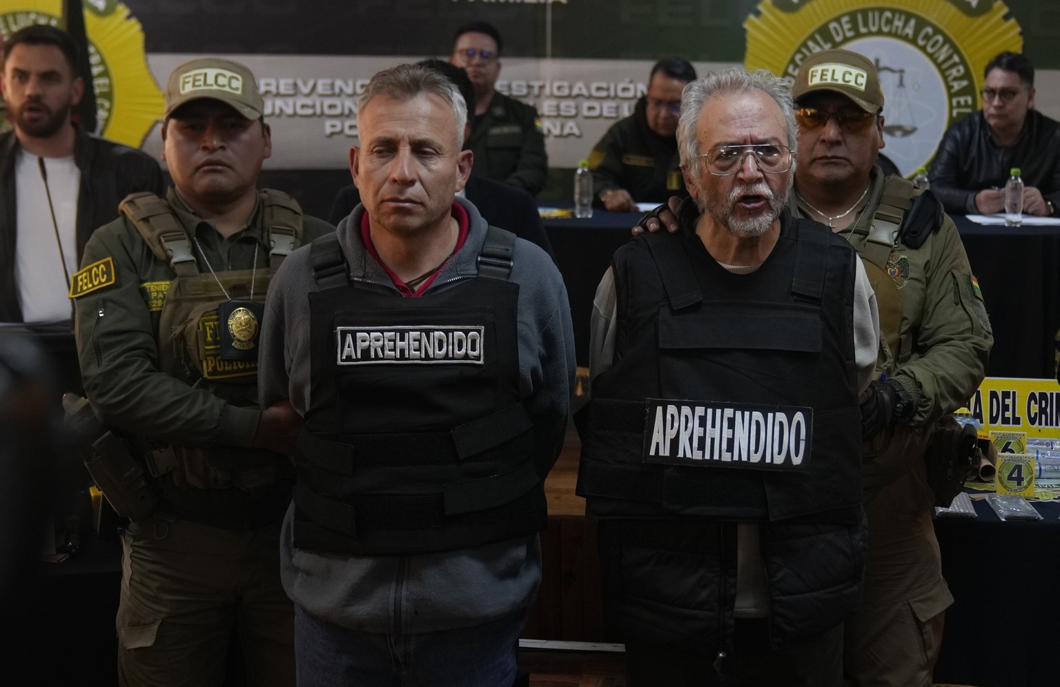 Gen. Juan Mario Paulsen Sandi, left, and Anibal Aguilar Gomez, arrested for his alleged involvement in what President Luis Arce called a coup attempt, is presented to the press in La Paz, Bolivia, Thu ...