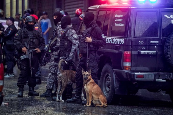 epa06928065 Members of different security forces stand guard and take evidence after an explosion targeted President Nicolas Maduro, in Caracas, Venezuela, 04 August 2018. The Venezuelan Information M ...