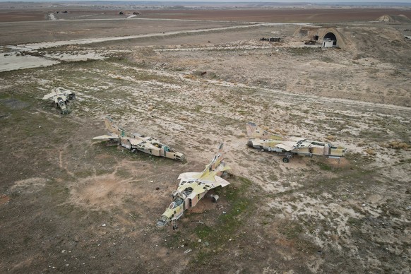 FILE - Decommissioned Syrian air force planes are seen at the Abu Duhur military air base east of Idlib, following the takeover of the area by Syrian opposition fighters on Saturday, Dec. 7, 2024. (AP ...