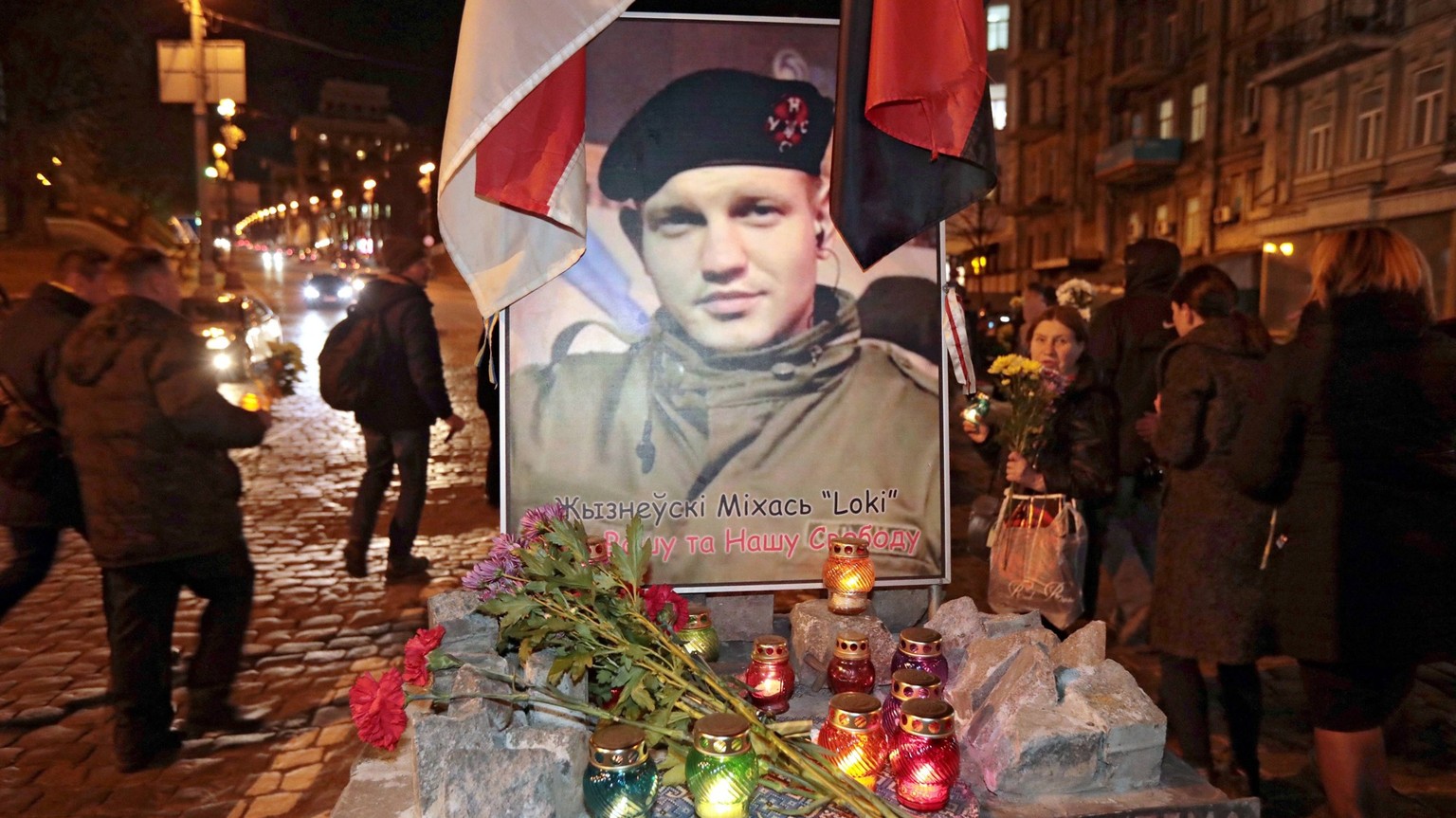 The portrait of Mikhail Zhiznevsky, a Belarusian citizen who was killed on January 22, 2014, can be seen on Hrushevskoho Street during the commemoration of the Heavenly Hundred Heroes, i.e. people killed ...
