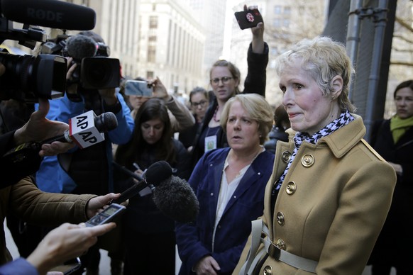 E. Jean Carroll, right, talks to reporters outside a courthouse in New York, Wednesday, March 4, 2020. As part of her defamation lawsuit against President Donald Trump, Carroll is seeking a DNA sample ...
