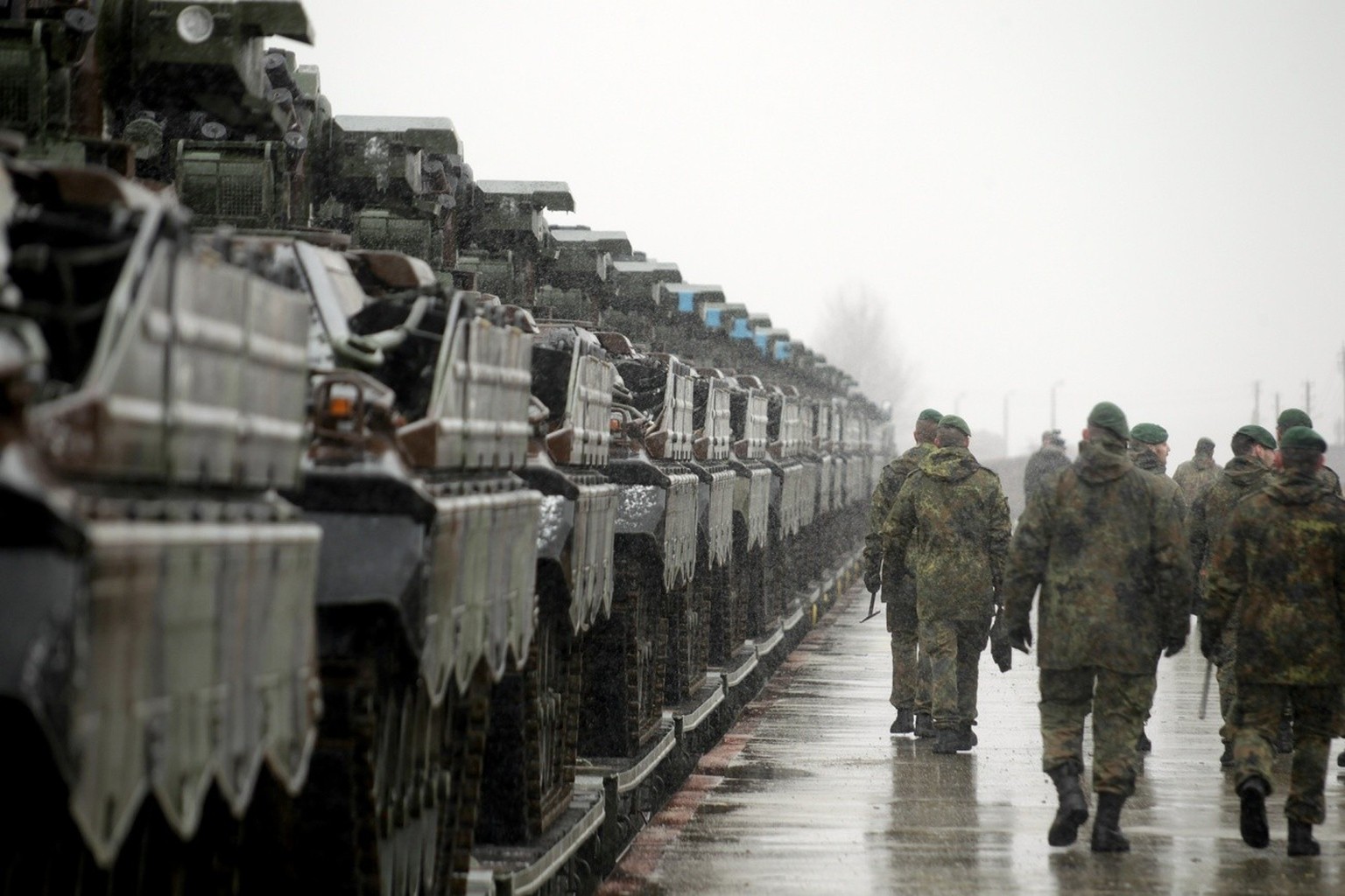 epa05812409 German infantry fighting vehicles Marder and other military equipment arrives in Sestokai, Lithuania, 24 February 2017. Around 60 vehicles, including Leopard tanks, Marder IFVs, Dachs engi ...