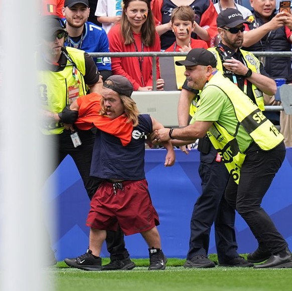 SEATTLE, USA - JULY 01: A pitch invader is apprehended by security during the 2026 FIFA World Cup Round of 32 match between Belgium and Senegal at Lumen Field (Seattle Stadium) in Seattle, Washington, ...