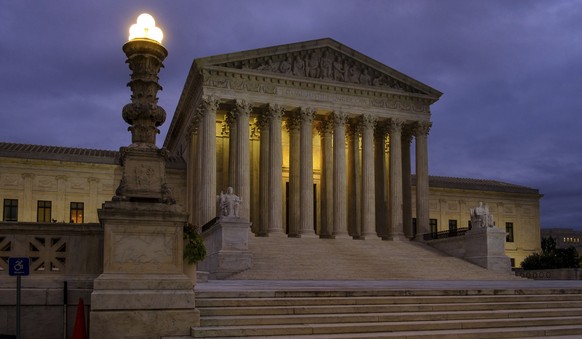 FILE - This Oct. 5, 2018, file photo shows the U. S. Supreme Court building before dawn in Washington. The Supreme Court term has steered clear of drama since the tumultuous confirmation of Justice Br ...