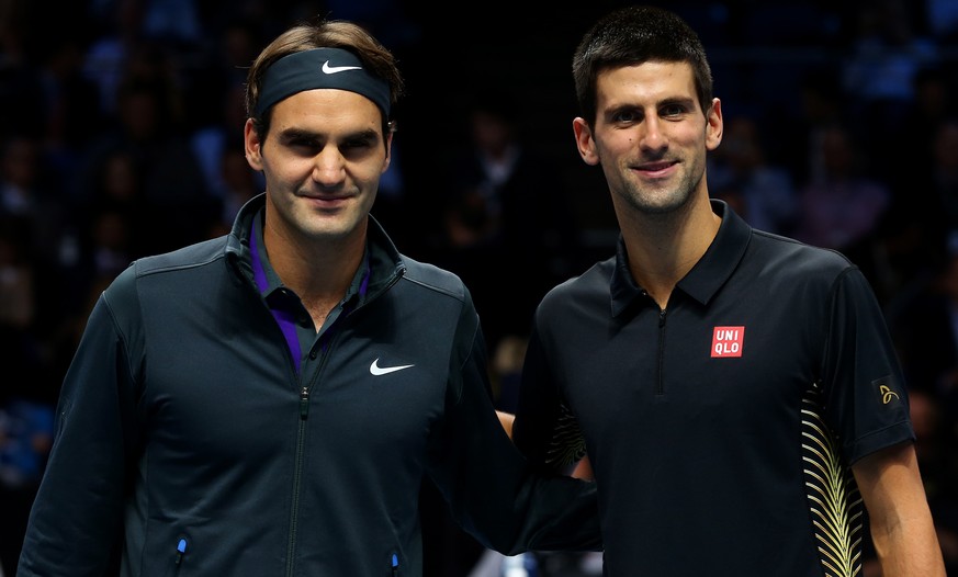 LONDON, ENGLAND - NOVEMBER 12: Roger Federer of Switzerland poses next to Novak Djokovic of Serbia before their men&#039;s singles final match during day eight of the ATP World Tour Finals at O2 Arena ...