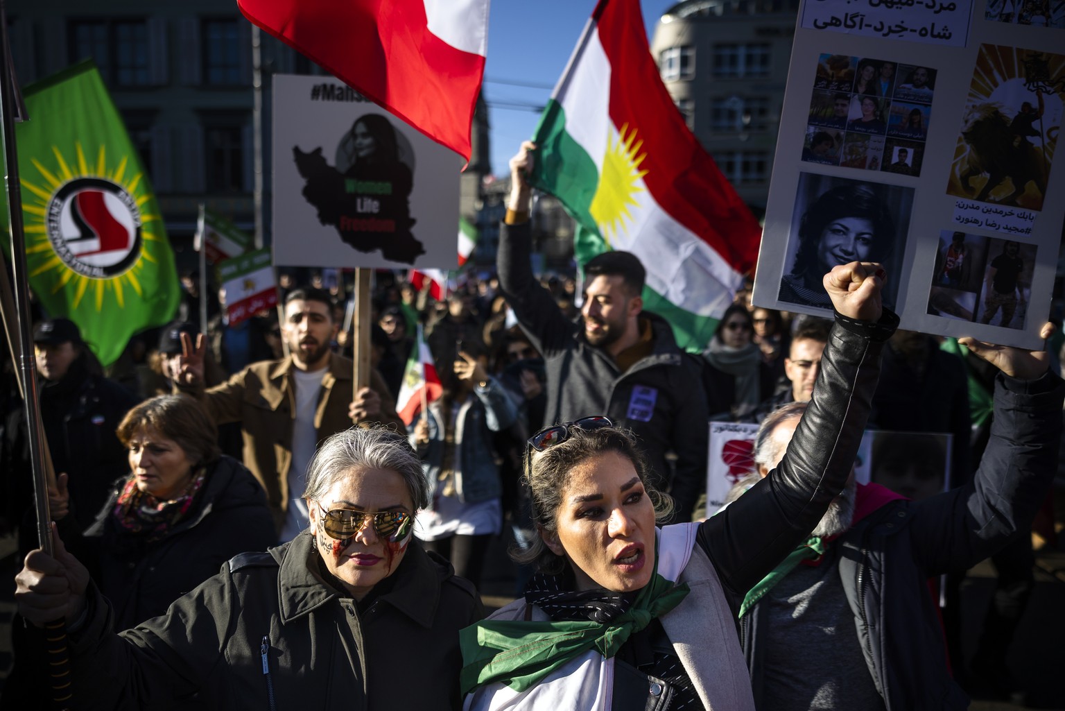 Protesters attend a rally in solidarity with the protests in Iran and in honor of protesters allegedly killed by the Iranian government, on Saturday, December 7, 2023 in Zurich, Switzerland.  (KEYSTONE/Mi ...