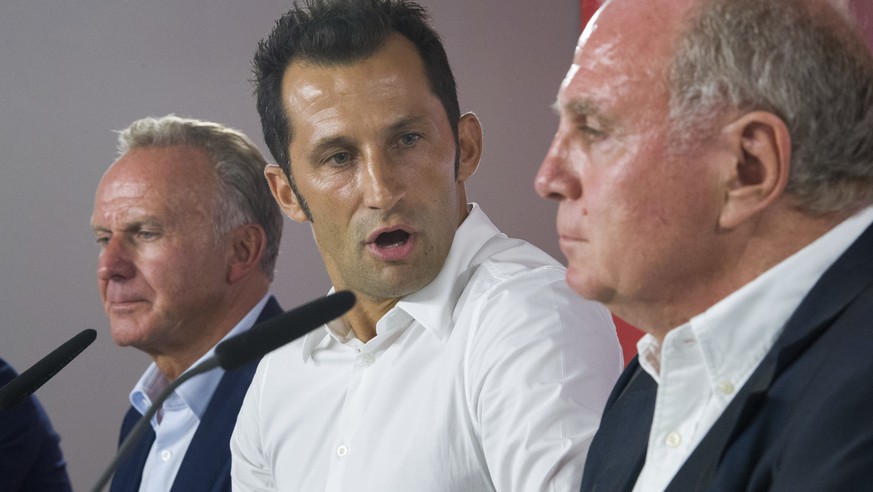 Hasan Salihamidzic center, is framed by Bayern CEO Karl-Heinz Rummenigge, left, and Bayern Munich president Uli Hoeness, right, in Munich, Germany, Monday, July 31, 2017. Salihamidzic was announced ne ...