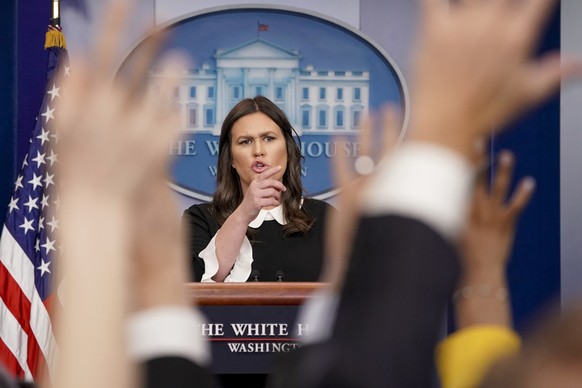 White House press secretary Sarah Huckabee Sanders calls on a reporter during the daily press briefing at the White House, Tuesday, March 27, 2018, in Washington. Sanders discussed the removal of Russ ...