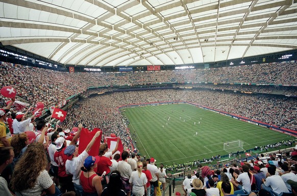 FILE - The crowd cheers as the United States plays Switzerland, the first World Cup soccer game ever played indoors, during a Group A World Cup soccer match, Saturday, June 18, 1994, at the Silverdome ...