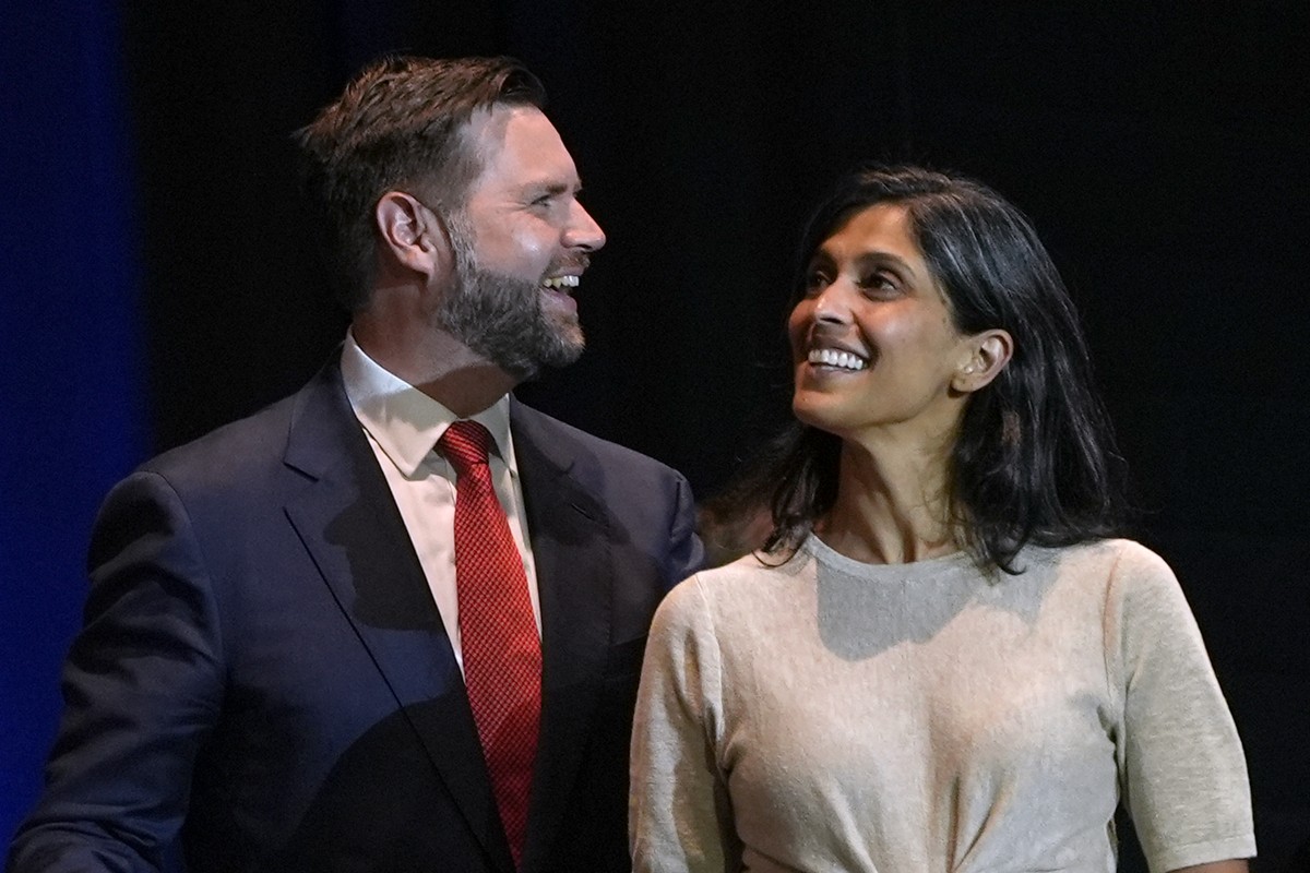 Republican vice presidential candidate Sen. JD Vance, R-Ohio, left, and his wife Usha Vance arrive at a campaign rally at Middletown High School, Monday, July 22, 2024, in Middletown, Ohio. (AP Photo/ ...