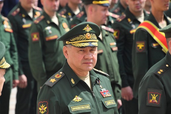 Moscow. Defense Minister Sergei Shoigu center before Russian President Vladimir Putin s address to the units of the Russian Defense Ministry, the Federal Service of National Guard Troops, the Federal  ...