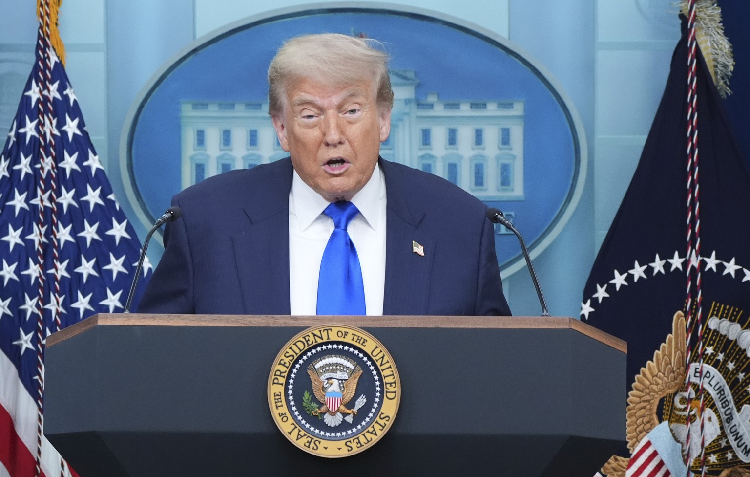 President Donald Trump speaks to the media as Attorney General Pam Bondi, right, and Deputy Attorney General Todd Blance, left, listen, Friday, June 27, 2025, in the briefing room of the White House i ...
