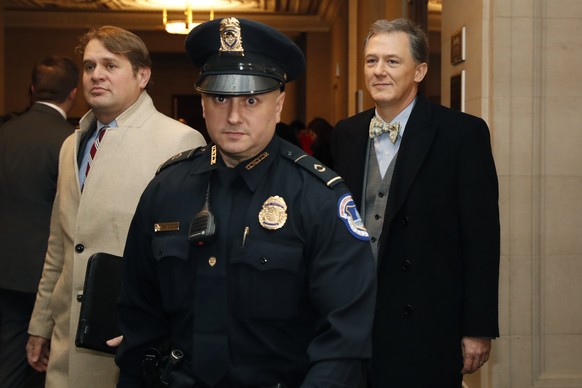 Career Foreign Service officer George Kent, right, arrives to testify before the House Intelligence Committee on Capitol Hill in Washington, Wednesday, Nov. 13, 2019, during the first public impeachme ...