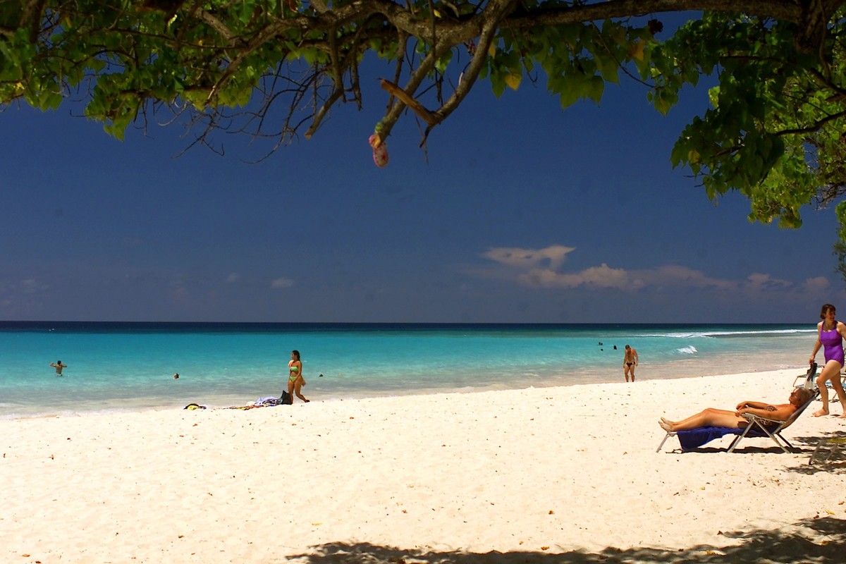 Several tourists enjoy Rockley beach, in the resort town of Rockley, in the parish Church Christ, Barbados, Thursday, Sept. 13, 2001. Resorts across the Caribbean stand empty, beachfronts void of tour ...