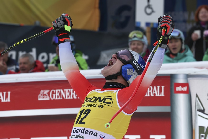 Switzerland&#039;s Marco Odermatt celebrates at the finish area of an alpine ski, men&#039;s World Cup downhill, in Val Gardena, Italy, Thursday, Dec.15, 2022. (AP Photo/Alessandro Trovati)