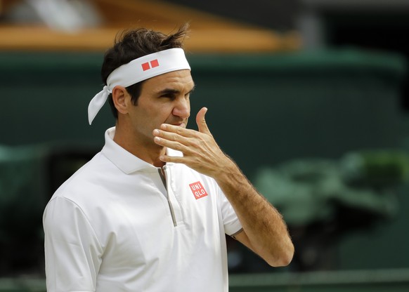 Switzerland&#039;s Roger Federer pauses after losing a point during a men&#039;s singles semifinal match against Spain&#039;s Rafael Nadal on day eleven of the Wimbledon Tennis Championships in London ...