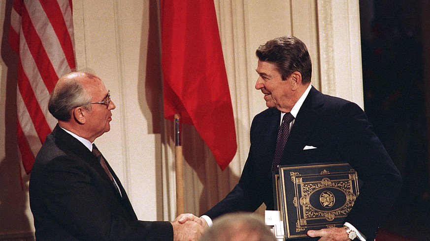 FILE - Int this Dec. 8, 1987, file photo, U.S. President Ronald Reagan, right, shakes hands with Soviet leader Mikhail Gorbachev after the two leaders signed the Intermediate Range Nuclear Forces Trea ...