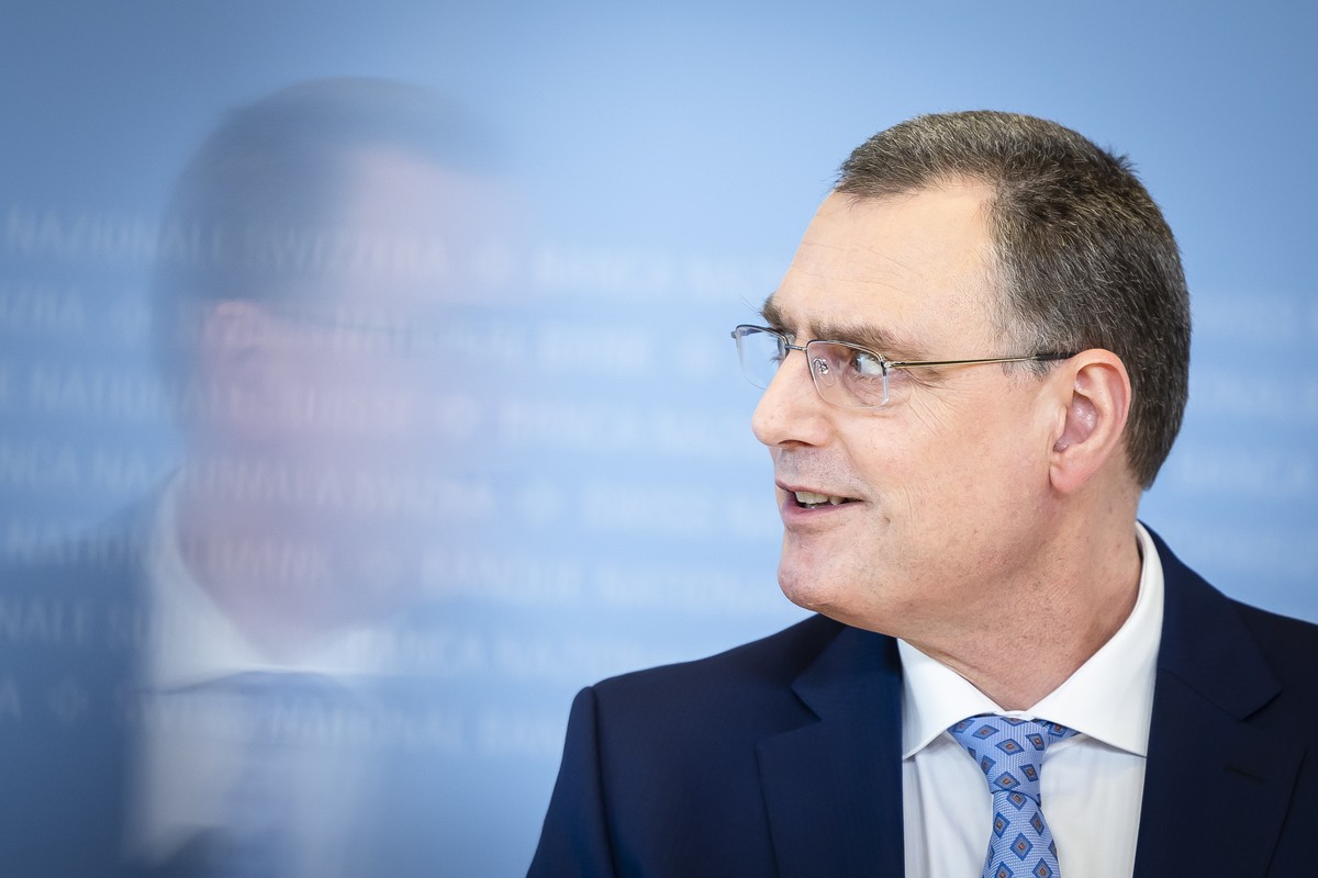 Swiss National Bank's (SNB) Chairman of the Governing Board Thomas Jordan is mirrored in a screen as gestures during a media briefing at the Swiss National Bank in Zurich, Switzerland, on Thursda ...