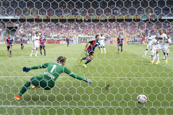 Basel&#039;s Matias Delgado, center back, scores with a penalty against Sion&#039;s goalkeeper Anton Mitryushkin, front, during a Super League match between FC Basel 1893 and FC Sion, at the St. Jakob ...