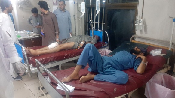 epa13147461 Injured victims receive medical treatment at a hospital after a suicide bombing in Mingora, Swat, Pakistan, 02 August 2026. At least 14 people, including eight police officials, were kille ...