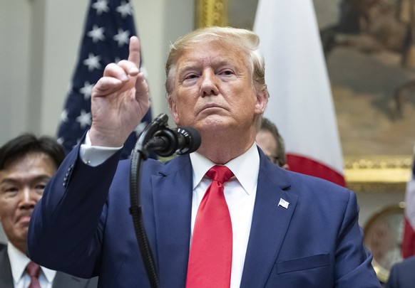 epa07904655 US President Donald J. Trump takes questions from the press after the US-Japan Trade Agreement and US-Japan Digital Trade Agreement were signed in the Roosevelt Room of the White House in  ...