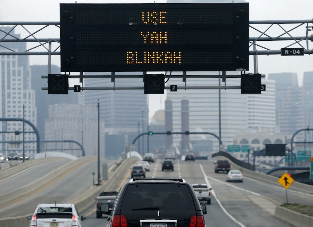 An electronic highway sign is seen on Interstate 93 in Boston, Friday, May 9, 2014. The Massachusetts Dept. of Transportation posted the message "Changing Lanes? Use Yah Blinkah" on the sign ...