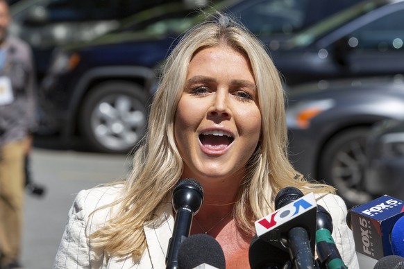 FILE - Karoline Leavitt speaks to the news media across the street from Republican presidential nominee former President Donald Trump&#039;s criminal trial in New York, May 28, 2024. (AP Photo/Ted Sha ...