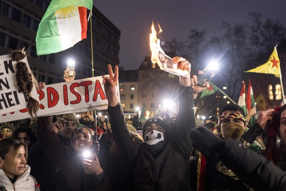 Protestors burn a portrait of syrian president Ahmed al-Scharaa during the Rojava rally against syrian violence and the interventions in Kurdistan and the kurdish controlled areas in Damaskus, in Zuer ...