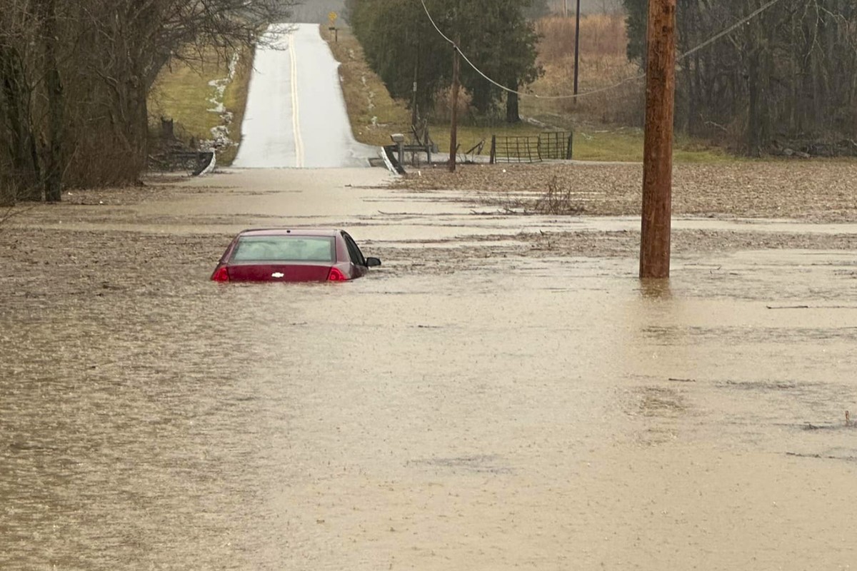 This photo provided by the Warren County, Ky., Sheriff's Office shows a partially submerged car outside of Bowling Green, Ky., on Saturday, Feb. 15, 2025. (Warren County Sheriff's Office via ...