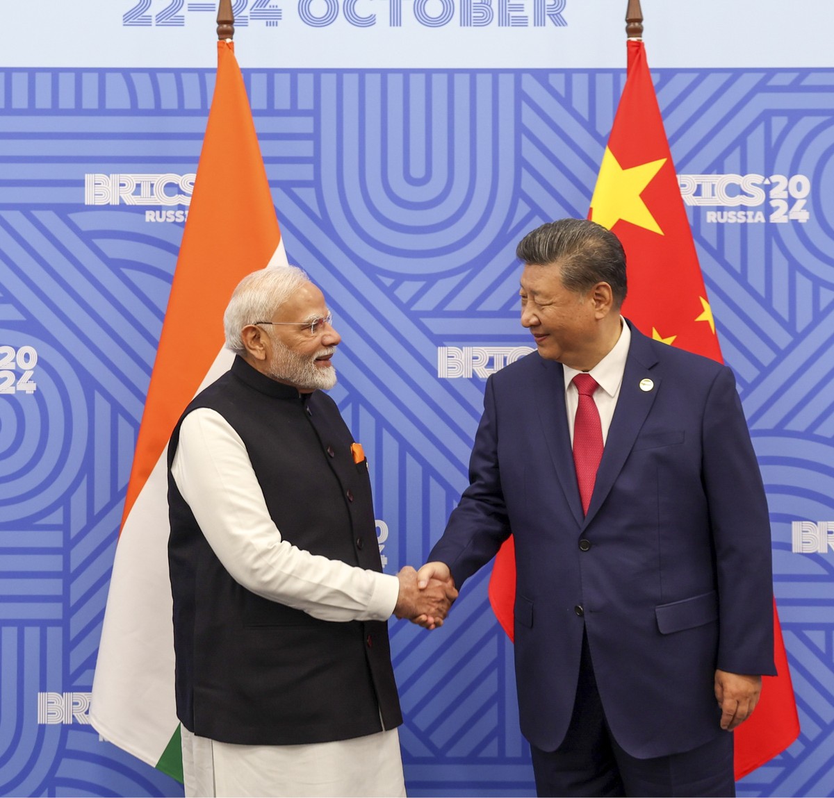 This photograph shared by Ministry of Information and Broadcasting, Government of India, on the X platform shows Chinese President Xi Jinping, right, shaking hands with Indian Prime Minister Narendra  ...