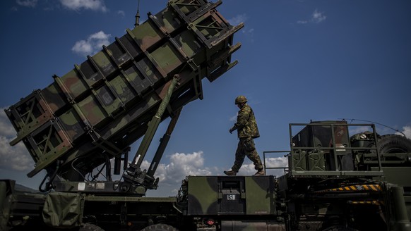 epa09937880 A German soldier walks during presentation of how it works at the launching station of NATO's Patriot missile air defense system operated by German army unit Flugabwehrraketengruppe 2 ...
