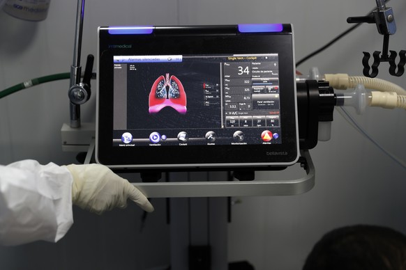 A ventilator monitor displays the oxygen entering the lungs of a COVID-19 in an intensive care unit of the National Hospital in Itaugua, Paraguay, Wednesday, March 17, 2021, amid the new coronavirus p ...