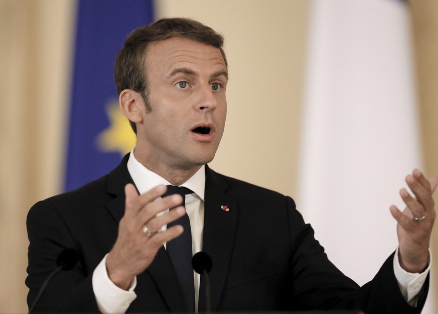 French President Emmanuel Macron gestures during a joint press conference with Romanian counterpart Klaus Iohannis, in Bucharest, Romania, Thursday, Aug. 24, 2017. Macron said Thursday he is &quot;con ...