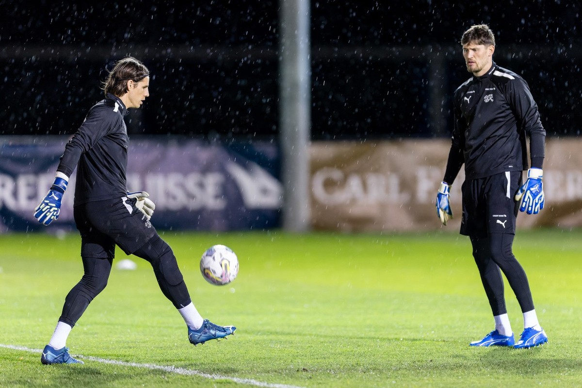 Goalkeeper Yann Sommer of Switzerland, left, and goalkeeper Gregor Kobel play the ball during a training session for the upcoming UEFA EURO 2024 European qualifying Group I matches against Israel, Kos ...