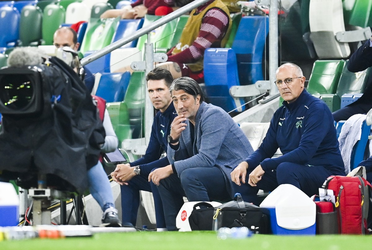 epa09456315 Switzerland's head coach Murat Yakin (C-R) reacts during the FIFA World Cup 2022 group C qualifying soccer match between Northern Ireland and Switzerland at Windsor Park stadium in Be ...