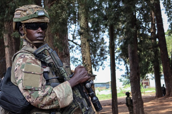 epa11916345 An armed soldier with the M23 armed group keeps watch in Bukavu, South Kivu, Democratic Republic of the Congo (DR Congo), 22 February 2025. The M23 armed group seized Goma and Bukavu, two  ...