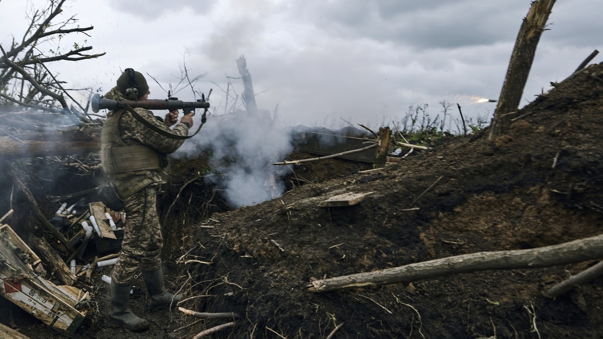 A Ukrainian soldier fires an RPG toward Russian positions at the frontline near Avdiivka, an eastern city where fierce battles against Russian forces have been taking place, in the Donetsk region, Ukr ...