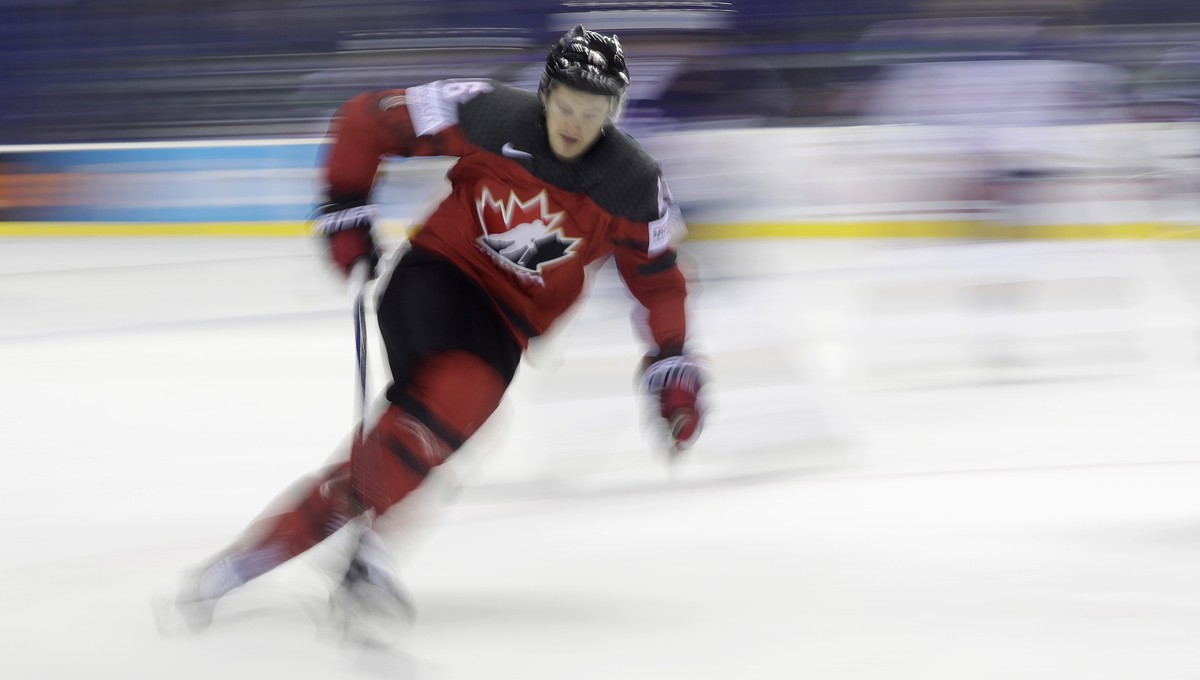 In this photo taken with slow shutter speed Canada's Jared McCann controls the puck during the Ice Hockey World Championships group A match between Great Britain and Canada at the Steel Arena in  ...