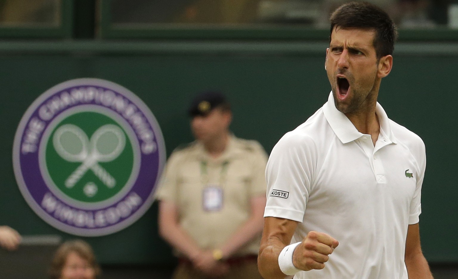 Serbia&#039;s Novak Djokovic celebrates winning a point as he plays against Adrian Mannarino of France during their Men&#039;s Singles Match on day eight at the Wimbledon Tennis Championships in Londo ...