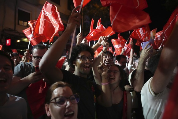 Socialist Workers&#039; Party supporters cheer as they wait for Prime Minster and Socialist party leader Pedro Sanchez outside the party&#039;s headquarters in Madrid, Spain, Sunday July 23, 2023. Spa ...