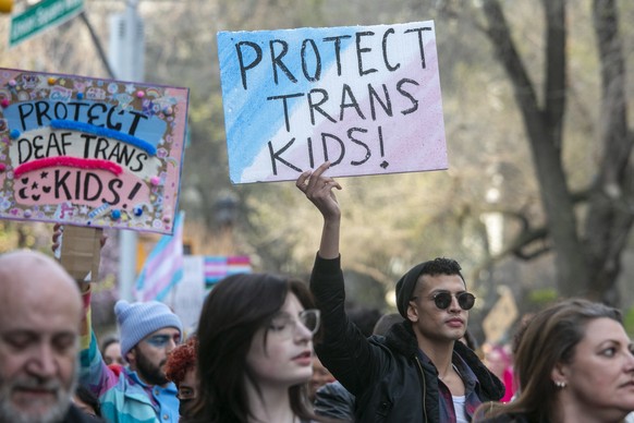 epa10553095 People march to show their support for the Transgender community on Trans Visibility Day during a rally in New York, New York, USA, 31 March 2023. Trans Visibility Day is an annual event d ...